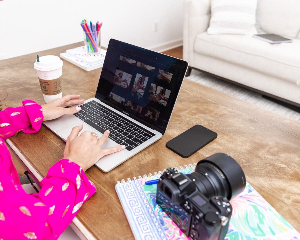 Photographer editing on laptop during Black Friday deal season