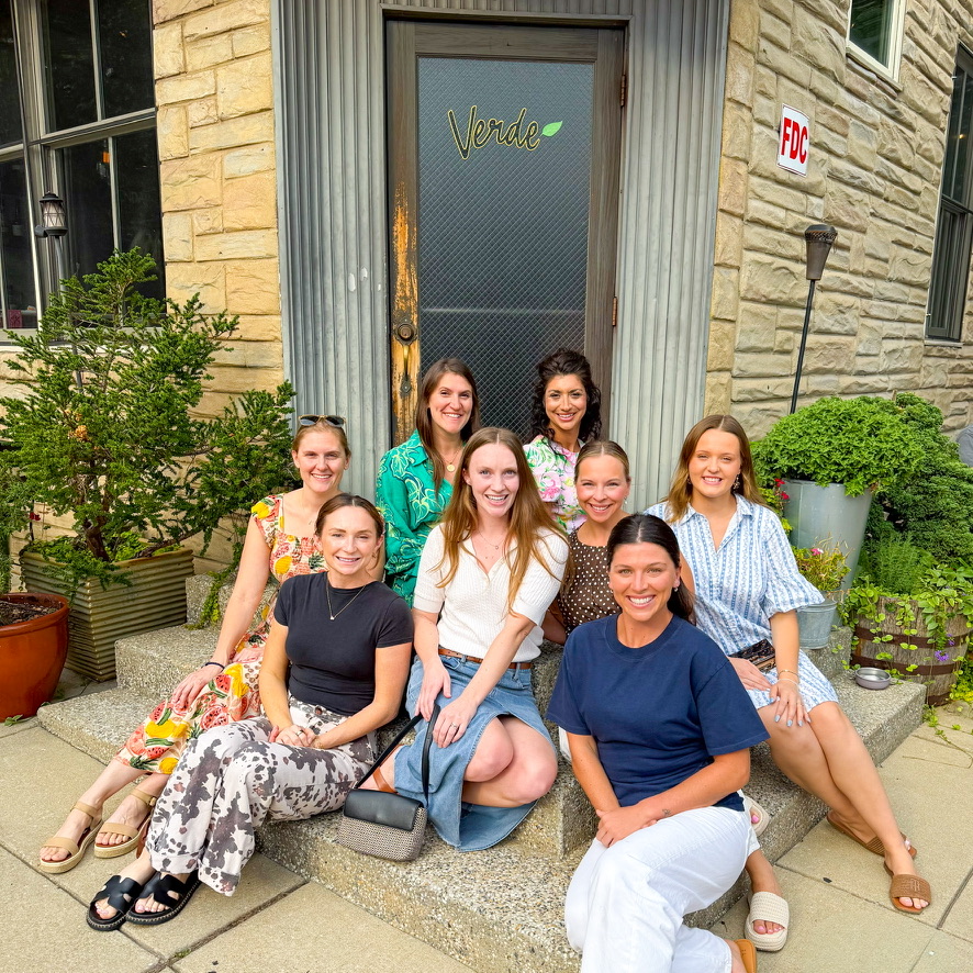 The BMORE Table founding members, a Baltimore event vendor community, gathered on the steps outside Verde in Baltimore for their first pilot event.